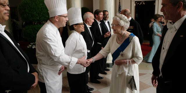 Queen Elizabeth offers her sincere thanks to members of the Executive Residence Staff of the White House who helped put together the State Dinner in her honor. (Photo as it appears in 