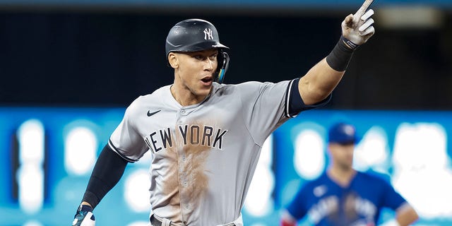 Aaron Judge of the New York Yankees runs the bases after hitting his 61st home run of the season during the seventh inning against the Toronto Blue Jays, Sept. 28, 2022, in Toronto.