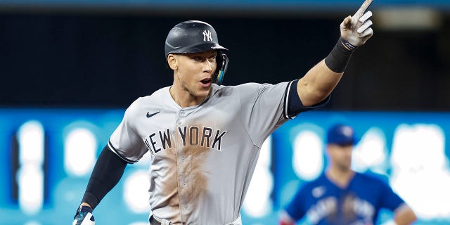 Aaron Judge of the New York Yankees runs the bases after hitting his 61st home run of the season during the seventh inning against the Toronto Blue Jays, Sept. 28, 2022, in Toronto.