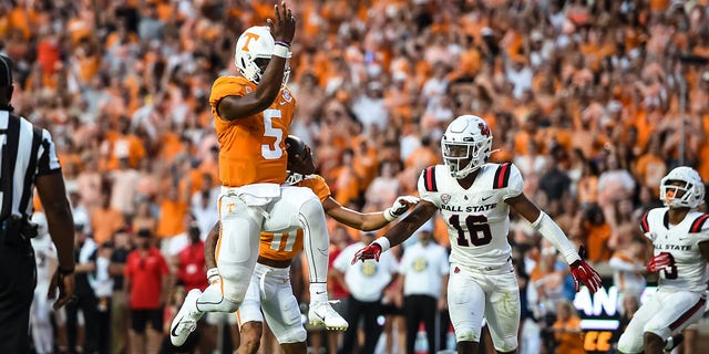 Tennessee Volunteers quarterback Hendon Hooker (5) jumps into the end zone for a touchdown during a game against the Ball State Cardinals Sept. 1, 2022, at Neyland Stadium, in Knoxville, Tenn. 
