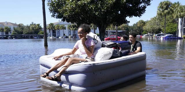 Students at the University of Central Florida are shown using inflatable mattresses to evacuate an apartment complex near the campus that was completely flooded by Hurricane Ian in Orlando, Florida. "heed the warnings of local authorities," Fox News medical contributor Dr. Janette Nesheiwat said: