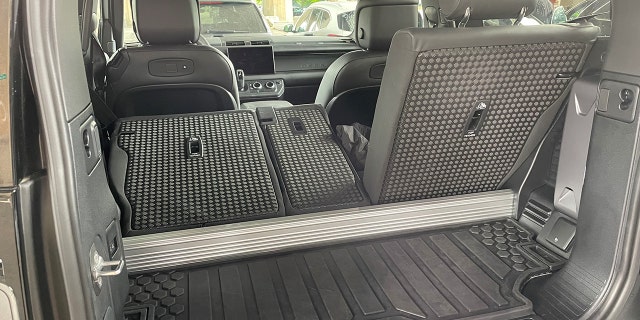 The Defender 90 V8's cargo area is small, and there's a support beam that intrudes into the space.