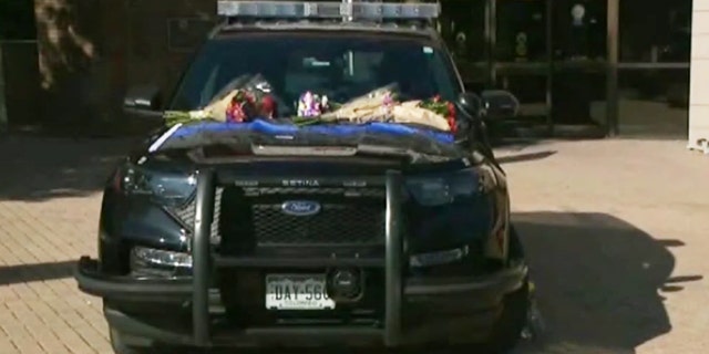 Patrol car sits outside Arvada Police Department in Colorado after officer killed in the line of duty.