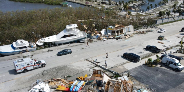 In this photo taken by a drone, the two-story Getaway Marina building, front, lies reduced to rubble as displaced boats rest along the roadside and a trailer park, at top, lies nearly devoid of homes, following the passage of Hurricane Ian, on San Carlos Boulevard in Fort Myers Beach, Florida, Thursday, Sept. 29, 2022. 