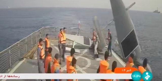 Iranian Navy sailors toss an American maritime drone overboard in the Red Sea in this frame grab from Iranian state television on Thursday, September 1, 2022.