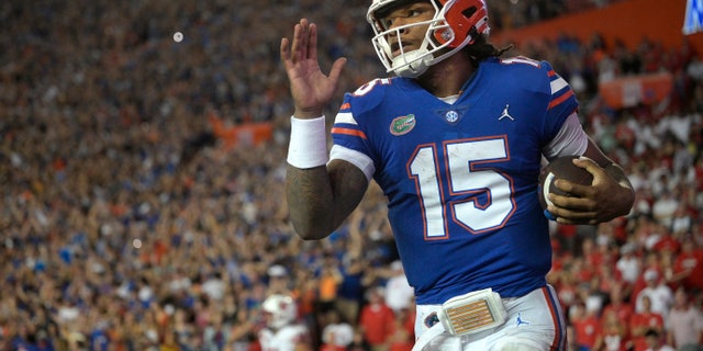 Florida quarterback Anthony Richardson (15) runs through the end zone after rushing for a 45-yard touchdown during the first half against Utah Sept. 3, 2022, in Gainesville, Fla. 