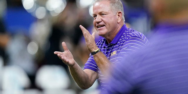 LSU head coach Brian Kelly encourages his team before an NCAA college football game against Florida State in New Orleans, Sunday, Sept.