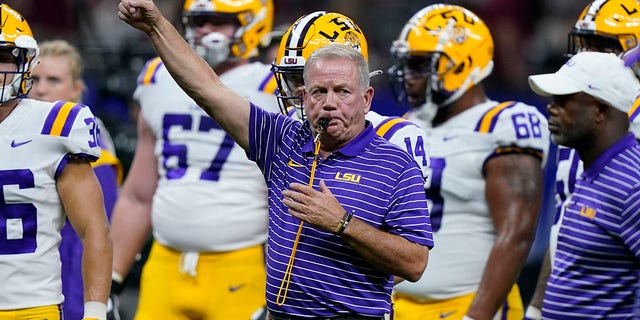LSU head coach Brian Kelly blows the whistle before an NCAA college football game against Florida State in New Orleans, Sunday, Sept. 