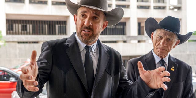 Otero County, New Mexico Commissioner Couy Griffin speaks to reporters as he arrives at federal court in Washington, Friday, June. 17, 2022.