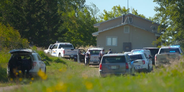In this image taken from video, Canadian law enforcement personnel surrounded a residence on the James Smith Cree First Nation reservation in Saskatchewan, Canada, on Tuesday, Sept. 6, 2022. 