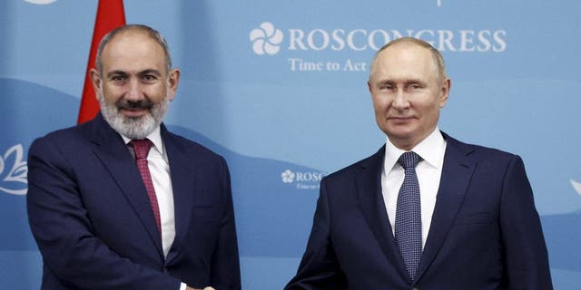 Russian President Vladimir Putin and Armenian Prime Minister Nikol Pashinyan meet on the sideline of the Eastern Economic Forum in Vladivostok, Russia, Sept. 7, 2022.