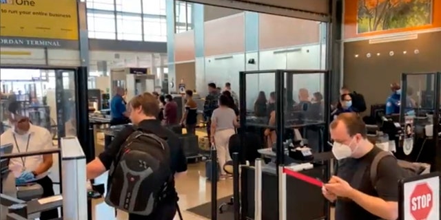 Travelers line up at a TSA screening area at Austin-Bergstrom International Airport in Austin, Texas, on Sept. 7, 2022. An early morning power outage at the airport caused flight delays that continued even after electricity was restored.