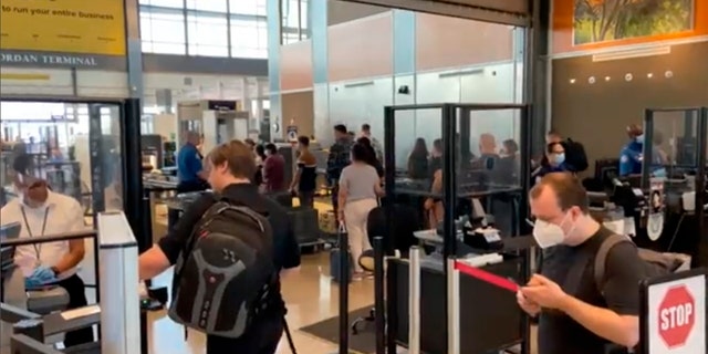 Travelers line up at a TSA screening area at Austin-Bergstrom International Airport in Austin, Texas, on Sept. 7, 2022. An early morning power outage at the airport caused flight delays that continued even after electricity was restored.