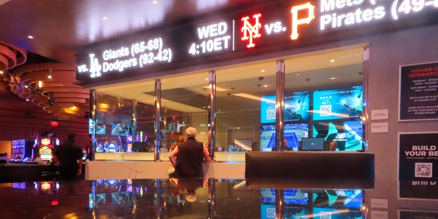 A customer makes a sports bet at the Ocean Casino Resort in Atlantic City, N.J. on Sept. 6, 2022. In the fifth year of legal sports betting in most U.S. states, the action is speeding up due to microbetting, the ability to place a bet on an outcome as narrowly targeted as the result of the next pitch in baseball or the next play in football. 