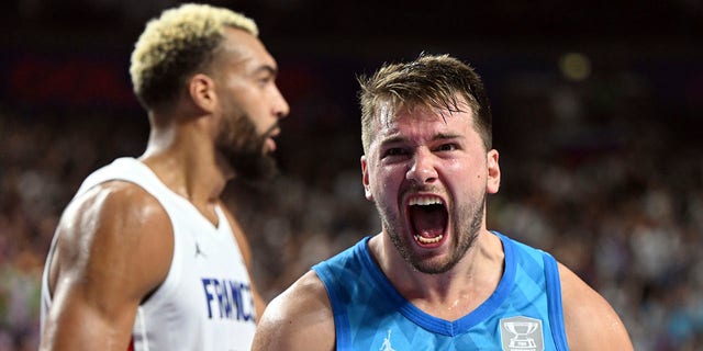 Slovenia's Luka Doncic celebrates a point during the EuroBasket Group B match against France in Cologne, Germany, on Sept. 7, 2022.