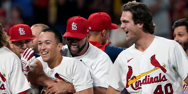 Cardinals' Tommy Edman gets a hug from Albert Pujols after hitting a two-run double in a win over the Washington Nationals on Wednesday, Sept. 7, 2022 in St. Louis.