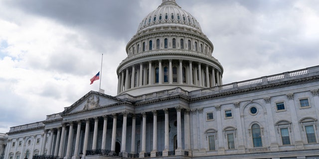 The American flag flies at half-staff over the U.S. Capitol, Thursday, Sept. 8, 2022,