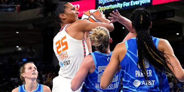 Connecticut Sun's Alyssa Thomas (25) shoots as Chicago Sky's Courtney Vandersloot (22) and Candace Parker defend during the first half of Game 5 in a WNBA basketball playoffs semifinal Thursday, Sept. 8, 2022, in Chicago. 