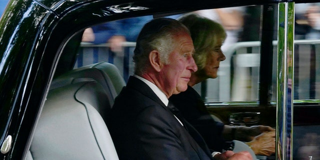 Britain's King Charles III and Camilla, the Queen Consort, arrive at Buckingham Palace after traveling from Balmoral following the death of Queen Elizabeth II on Thursday, in London, Friday, September 9, 2022. 