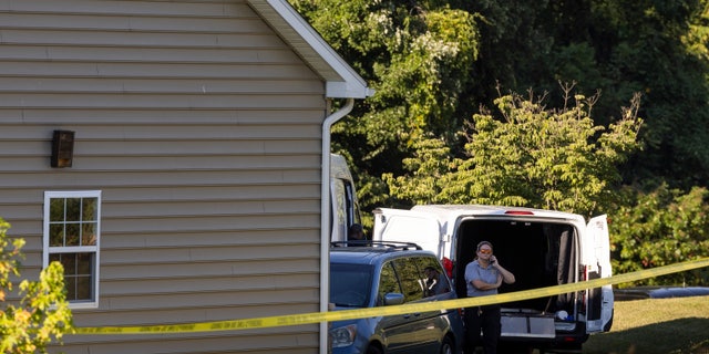 Law enforcement gather at the scene Friday, Sept. 9, 2022, in Elk Mills, Maryland. Five people were found dead inside a home in northeastern Maryland on Friday after deputies were called to investigate a report of a shooting.