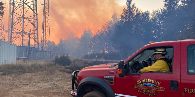 Firefighters use aircraft to battle a wildfire south of Salem, Ore., on Friday, Sept. 9, 2022. Climate change is bringing drier conditions to the Pacific Northwest and that requires strategies that have been common in fire-prone California for the past decade or more, said Erica Fleishman, director of the Oregon Climate Change Research Institute at Oregon State University.