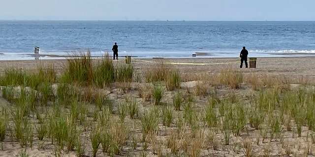 New York Police investigators examine a stretch of beach at Coney Island where three children were found dead in the surf, Monday, Sept. 12, 2022, in New York. 