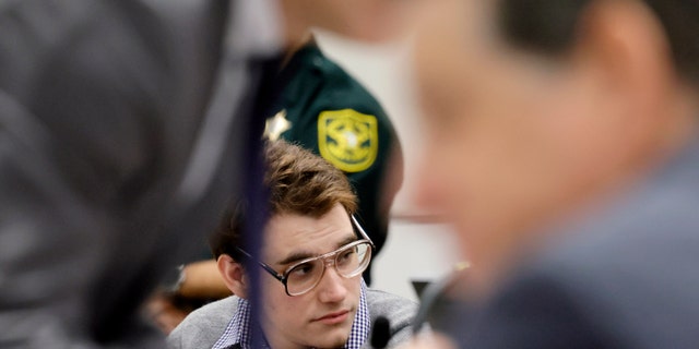 Marjory Stoneman Douglas High School shooter Nikolas Cruz is shown at the defense table during the penalty phase of Cruz's trial at the Broward County Courthouse in Fort Lauderdale, Fla., on Monday, Sept. 12, 2022. Cruz pleaded guilty to murdering 17 students and staff members in 2018 at Parkland's high school. The trial is only to determine if the 23-year-old is sentenced to death or life without parole.
