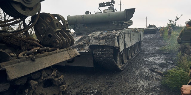 Ukrainian military vehicles move on the road in the freed territory in the Kharkiv region, Ukraine, Monday, Sept. 12, 2022. Ukrainian troops retook a wide swath of territory from Russia on Monday, pushing all the way back to the northeastern border in some places, and claimed to have captured many Russian soldiers as part of a lightning advance that forced Moscow to make a hasty retreat.