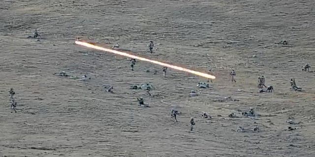 In this image taken from a YouTube video released by the Armenian Ministry of Defense on Tuesday 13 September 2022, it shows Azerbaijani soldiers crossing the Armenian-Azerbaijani border and approaching Armenian positions.  The Armenian Prime Minister says 49 soldiers were killed in Azerbaijan's night attacks.  (Armenian Ministry of Defense via AP)