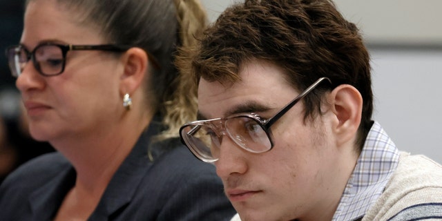 Marjory Stoneman Douglas High School shooter Nikolas Cruz watches a screen as neuropsychologist Paul Connor testifies