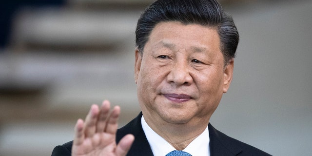 China's President Xi Jinping greets the media prior to a meeting of leaders of the BRICS emerging economies at the Itamaraty palace in Brasilia, Brazil