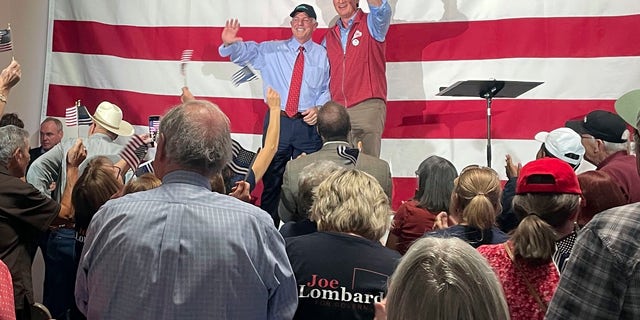 Virginia Governor Glenn Youngkin, center-right, gives a thumbs-up at an event in support of Republican Republican gubernatorial candidate Joe Lombardo, center-left, at the Nevada Trucking Association in Reno, Nevada.  Lombardo, who is generally anti-abortion, says "It's the vote of the people of the state of Nevada, and I'm going to support that," on the prohibition of abortion.