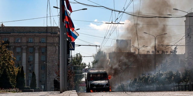 A vehicle on fire after shelling in Donetsk, an area controlled by Russian-backed separatist forces, in eastern Ukraine on Sept. 17, 2022.