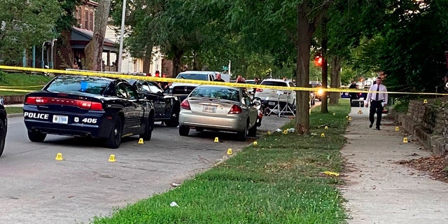 Evidence markers dot the scene, Aug. 10, 2022, in Richmond, Indiana, where Richmond Police Department Officer Seara Burton was critically wounded.