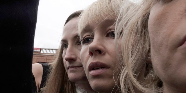 Sherri Papini, center, leaves the federal courthouse in Sacramento, California, on Monday after U.S. District Judge William Shubb sentenced her to 18 months in federal prison.