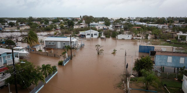 Streets are flooded on Salinas Beach after the passing of Hurricane Fiona in Salinas, Puerto Rico, Monday, Sept. 19, 2022.
