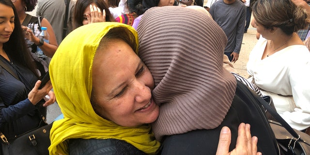 Shamim Syed, Adnan Syed's mother, left, celebrates with others outside the Cummings Courthouse, Monday, Sept. 19, 2022, in Baltimore. A judge has ordered the release of Adnan Syed after overturning his conviction for a 1999 murder that was chronicled in the hit podcast "Serial." 