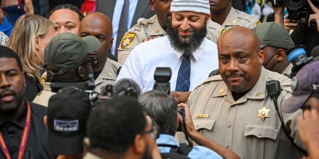 Adnan Syed, center, the man whose legal saga spawned the hit podcast "Serial," exits the Cummings Courthouse after a Baltimore judge overturned his conviction. A Maryland appeals court has refused to intervene in a lower court's decision to free Syed.