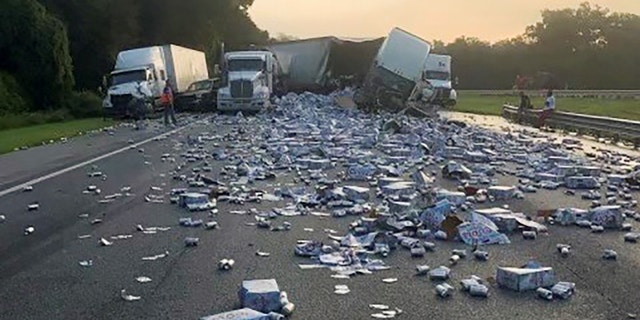 Cases of Coors Light beer were strewn across a highway after two semitrailers collided on the Florida road.