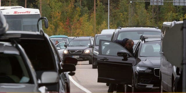 Cars queue to cross the border from Russia to Virolahti, Finland, Sept. 23, 2022.
