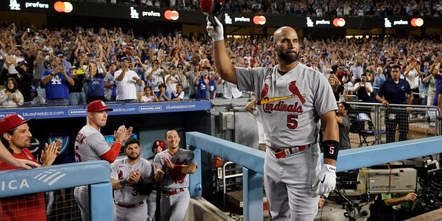 St. Louis Cardinals designated hitter Albert Pujols (5) celebrates after hitting a home run during the fourth inning of a baseball game against the Los Angeles Dodgers in Los Angeles, Friday, Sept. 23, 2022. Brendan Donovan and Tommy Edman also scored. It was Pujols' 700th career home run. 
