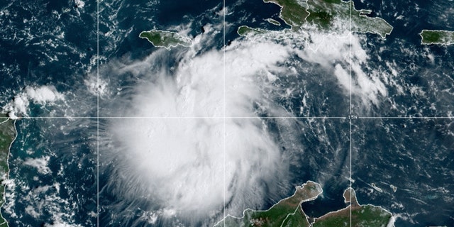 This satellite image provided by the National Oceanic and Atmospheric Administration shows Tropical Storm Ian over the central Caribbean on Saturday, September 24, 2022.  