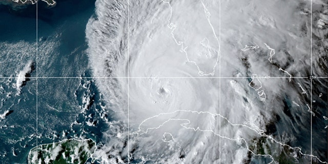 This GOES-East GeoCcolor satellite image taken at 10:10 p.m. EDT on Tuesday, Sept. 27, 2022, and provided by the National Oceanic and Atmospheric Administration (NOAA), shows Hurricane Ian over the Gulf of Mexico.