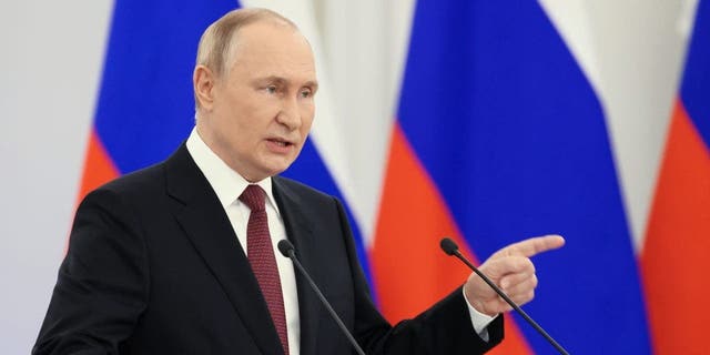 Russian President Vladimir Putin gestures during a ceremony to sign the treaties for four regions of Ukraine to join Russia at the Kremlin in Moscow on Friday. 