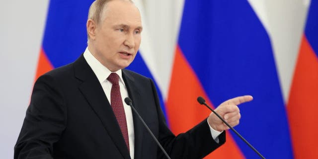 Russian President Vladimir Putin gestures during a ceremony to sign the treaties for four regions of Ukraine to join Russia at the Kremlin in Moscow on Friday. 