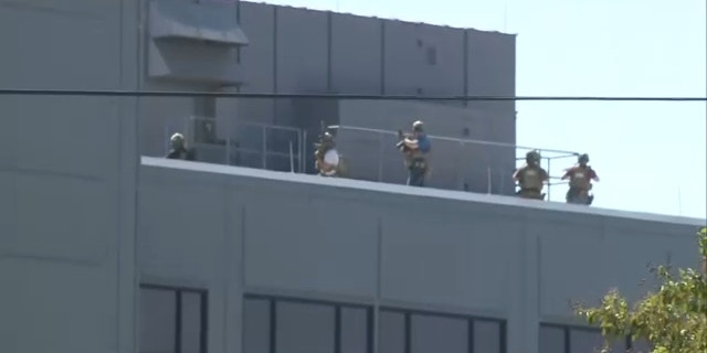 Law enforcement in tactical gear seen on the roof of the St. Vincent Hospital in Sherwood, Arkansas. 