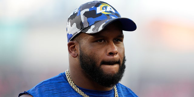 Los Angeles Rams defensive tackle Aaron Donald watches during the first half of a preseason NFL football game in Cincinnati, Saturday, Aug. 27, 2022.