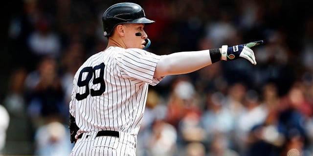 New York Yankees right fielder Aaron Judge, 99, reacts after hitting a double against the Minnesota Twins during the first inning of a baseball game in New York Monday, Sept. 5, 2022.