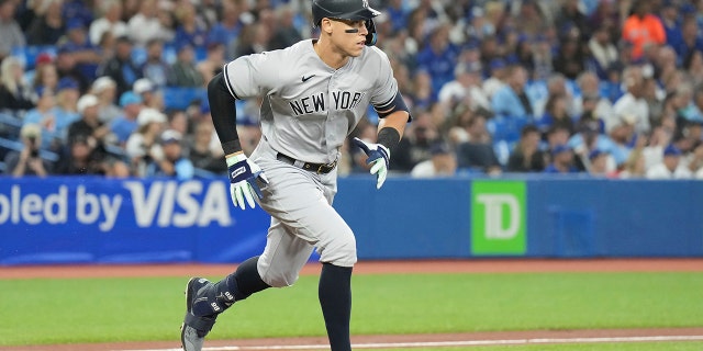 New York Yankees' Aaron Judge runs to first in Toronto, Monday, Sept. 26, 2022.