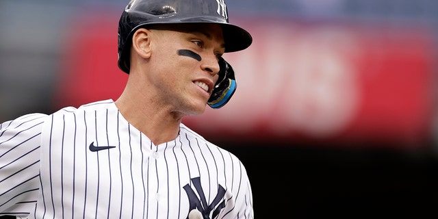 New York Yankees' Aaron Judge rounds the bases after hitting a home run during the fourth inning of the first baseball game of a doubleheader against the Minnesota Twins on Wednesday, Sept. 7, 2022, in New York.